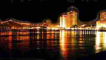 Mississippi River Bridge and New Orleans skyline at night